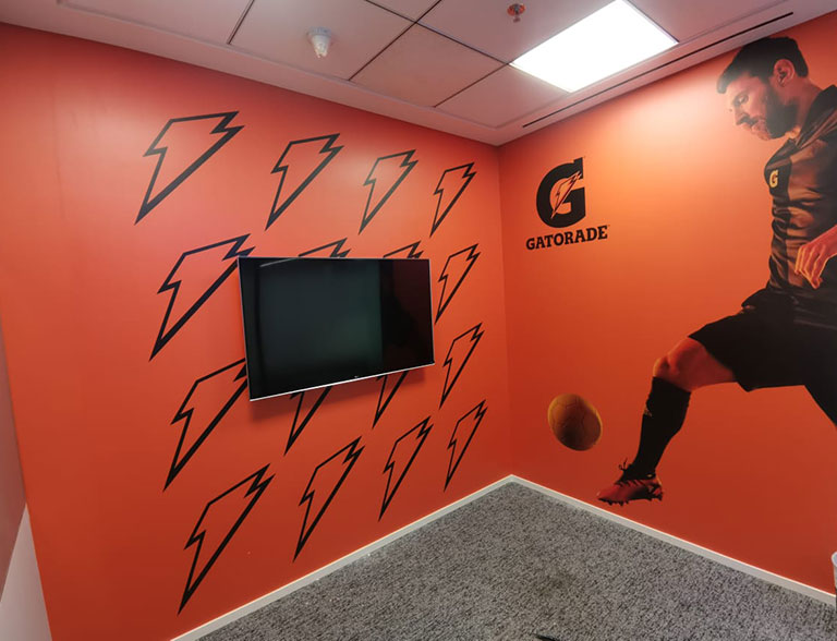 Gatorade branded wall graphics with athlete artwork and lightning icons in an office space